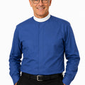 Man wearing a blue shirt with a white collar on a white background