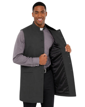 Man wearing a gray vest over a long-sleeve shirt on a white background