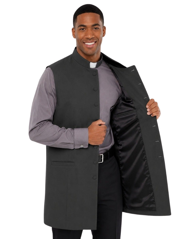 Man wearing a gray vest over a long-sleeve shirt on a white background