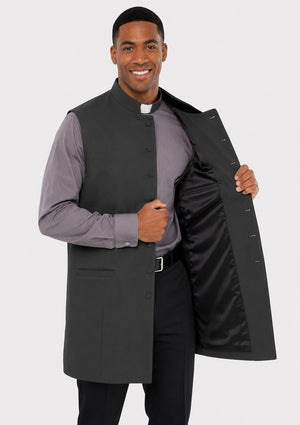Man holding a black cassock against a white background