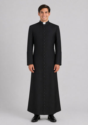 Man wearing a black cassock on a gray background