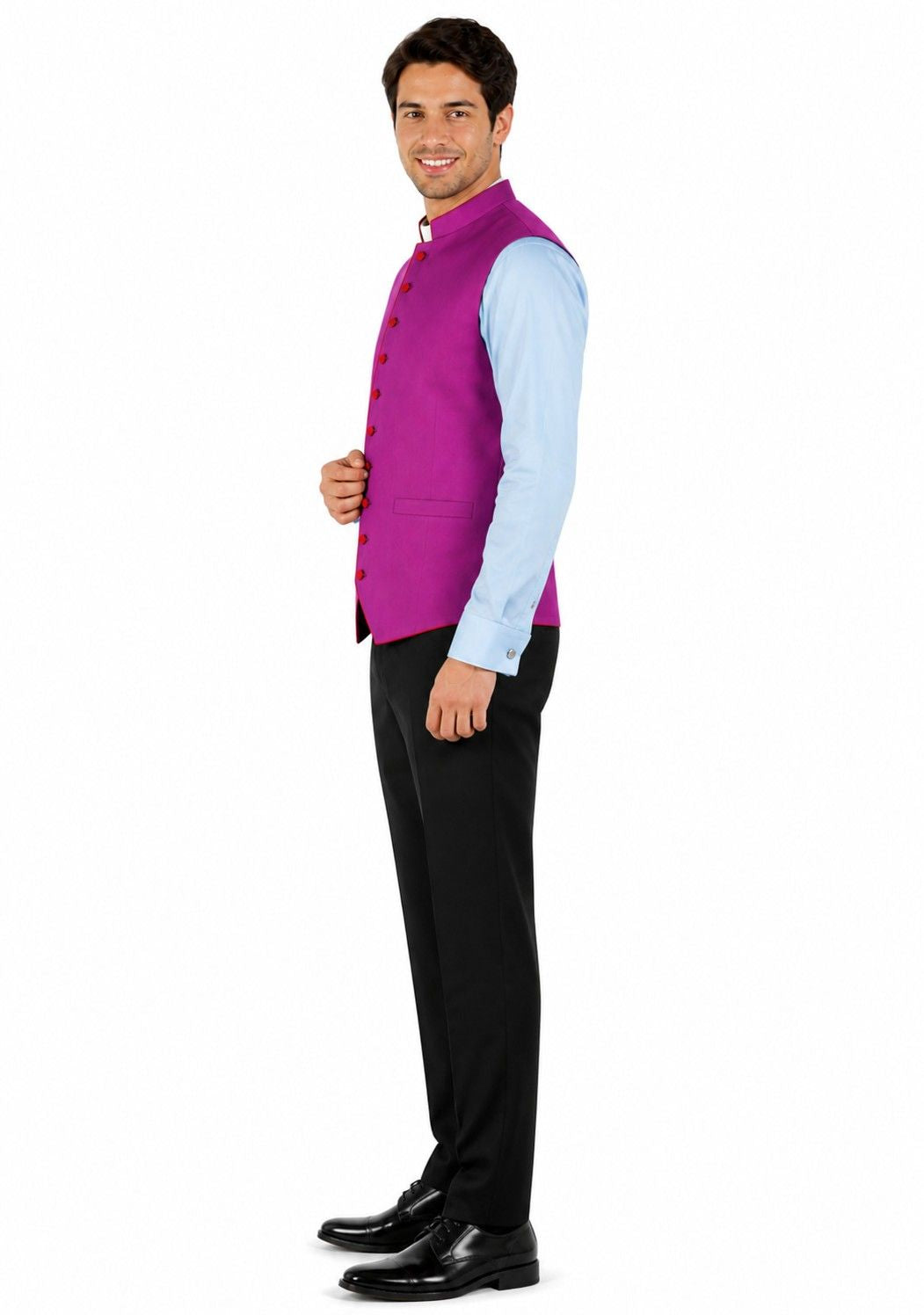 Man wearing a purple vest over a light blue shirt with black pants on a white background