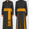 Long dark gray robe with yellow accents worn by a man on a white background