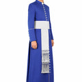 Man wearing a traditional blue and white outfit with a long scarf on a white background
