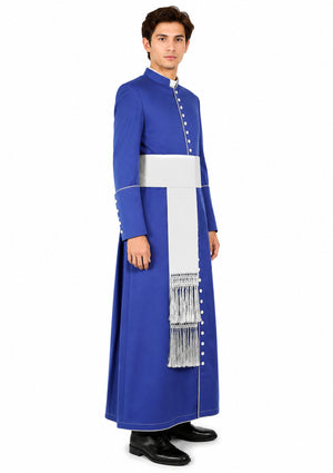 Man wearing a traditional blue and white outfit with a long scarf on a white background