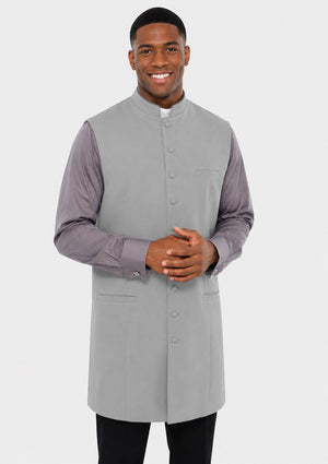 Man wearing a gray waistcoat over a purple shirt on a white background