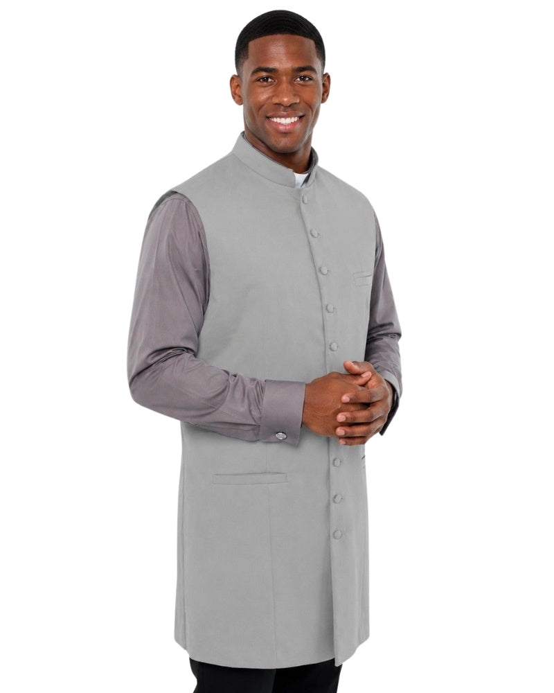 Man wearing a gray vest over a shirt on a white background