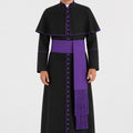 Man wearing a black robe with purple accents on a white background