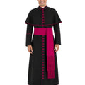 A man modeling a black papal collar and long robe with a bright pink sash and trim, set against a plain white background.