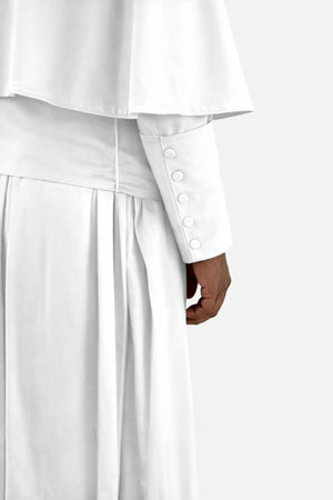 White outfit with buttons on a white background
