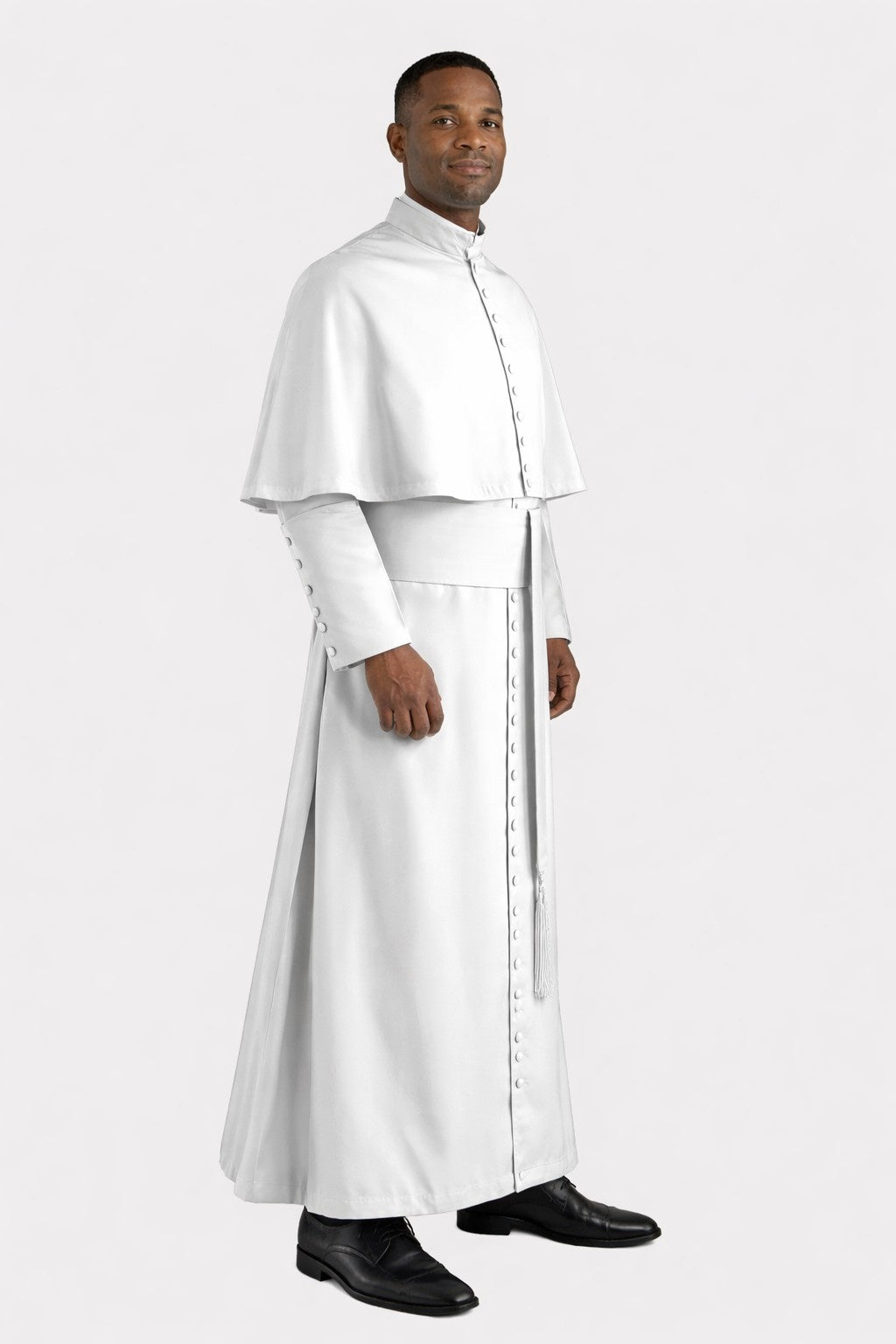 Man wearing a white religious robe on a white background