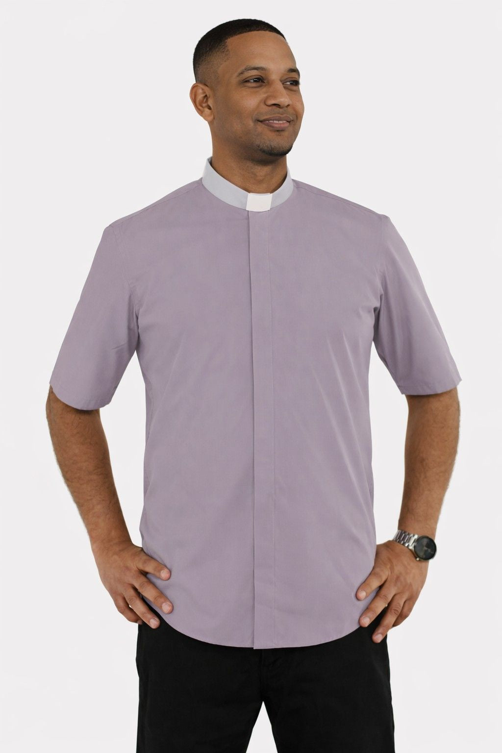 Man wearing a gray shirt with a white collar on a white background