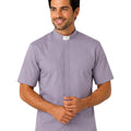 Man wearing gray clerical shirt on white background.