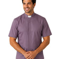 Man wearing a gray clerical shirt with a white collar on a white background