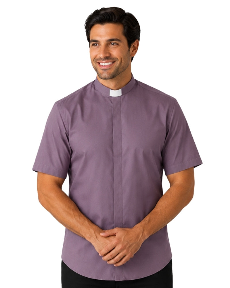 Man wearing a gray clerical shirt with a white collar on a white background