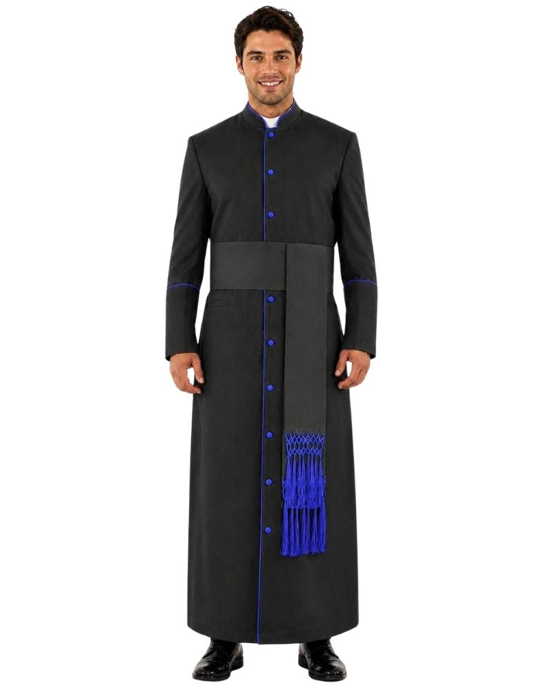 A man modeling a long black clerical cassock with bright blue trim, blue buttons, and a matching blue tassel detail, shown against a plain white background.