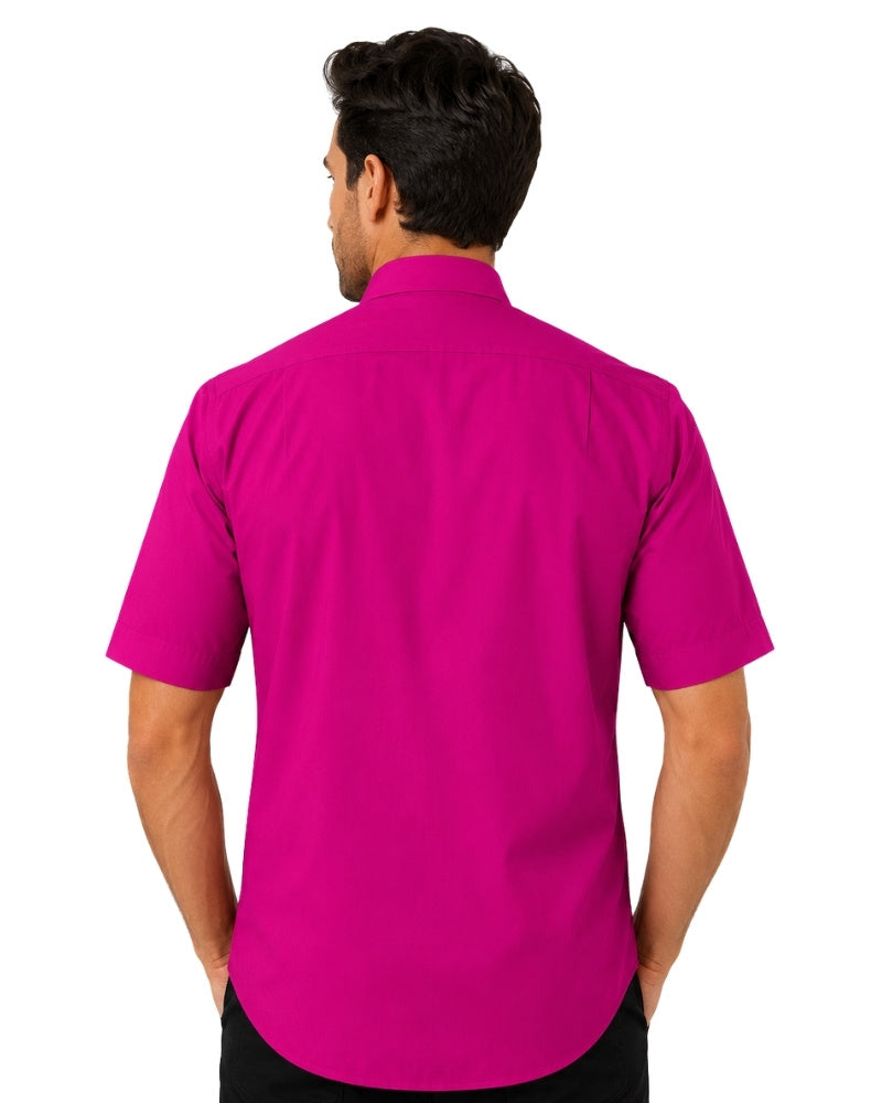 Man wearing a bright pink clerical shirt with a white collar on a white background