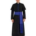 A man modeling a black papal collar cassock with royal blue trim, a matching blue sash, and a blue fringed stole, set against a plain white background.