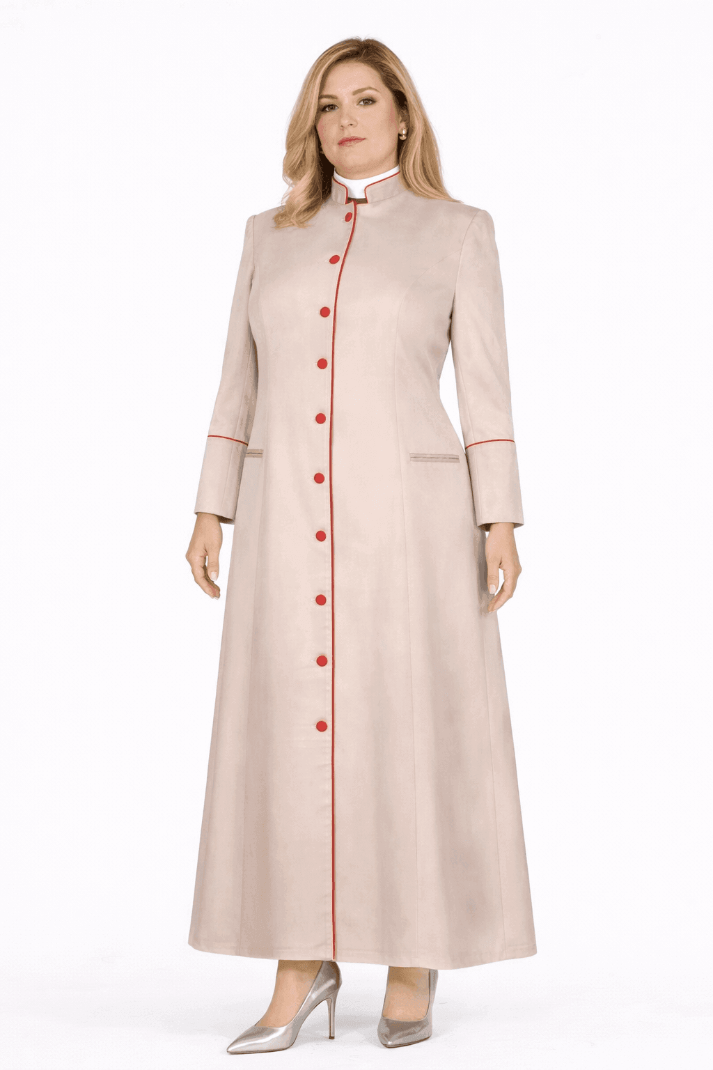 Woman wearing a long beige robe with red buttons on a white background