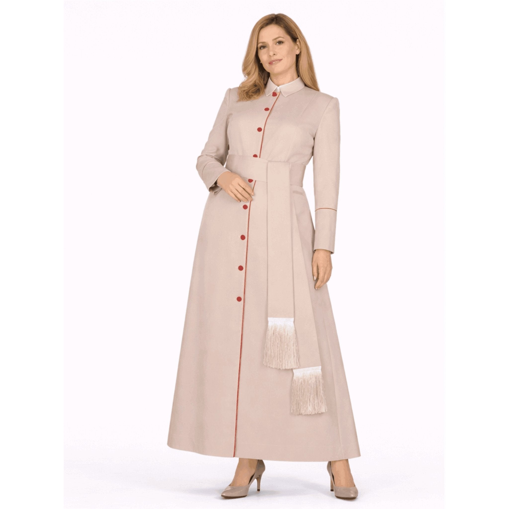 Woman wearing a long beige robe with red buttons on a white background