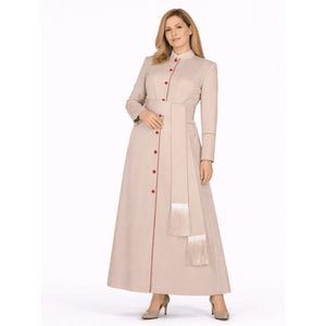 Woman wearing a long beige robe with red buttons on a white background