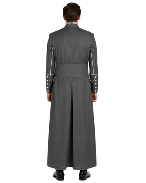 A man viewed from the back wearing a long dark gray cassock with white piping details along the shoulders and sleeves, set against a plain white background.