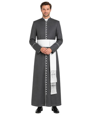 A man modeling a dark gray priestly cassock with a white waist sash, white collar, and white decorative fringes, set against a plain white background.