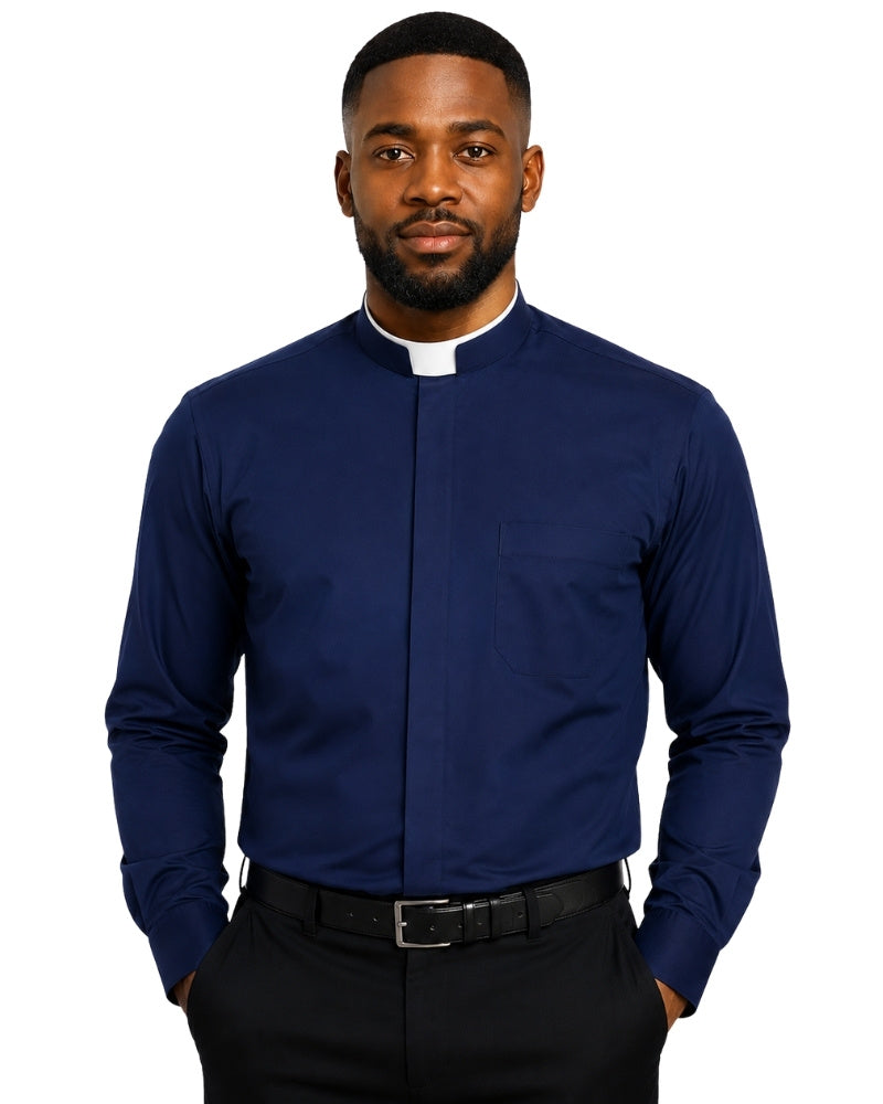 A man wearing a navy blue long-sleeve clerical shirt with a white collar tab, paired with black trousers and a black belt, against a plain white background.