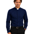 Man wearing a navy blue clerical shirt with a white collar on a white background