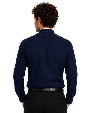 Man wearing a navy blue clerical shirt with a white collar on a white background