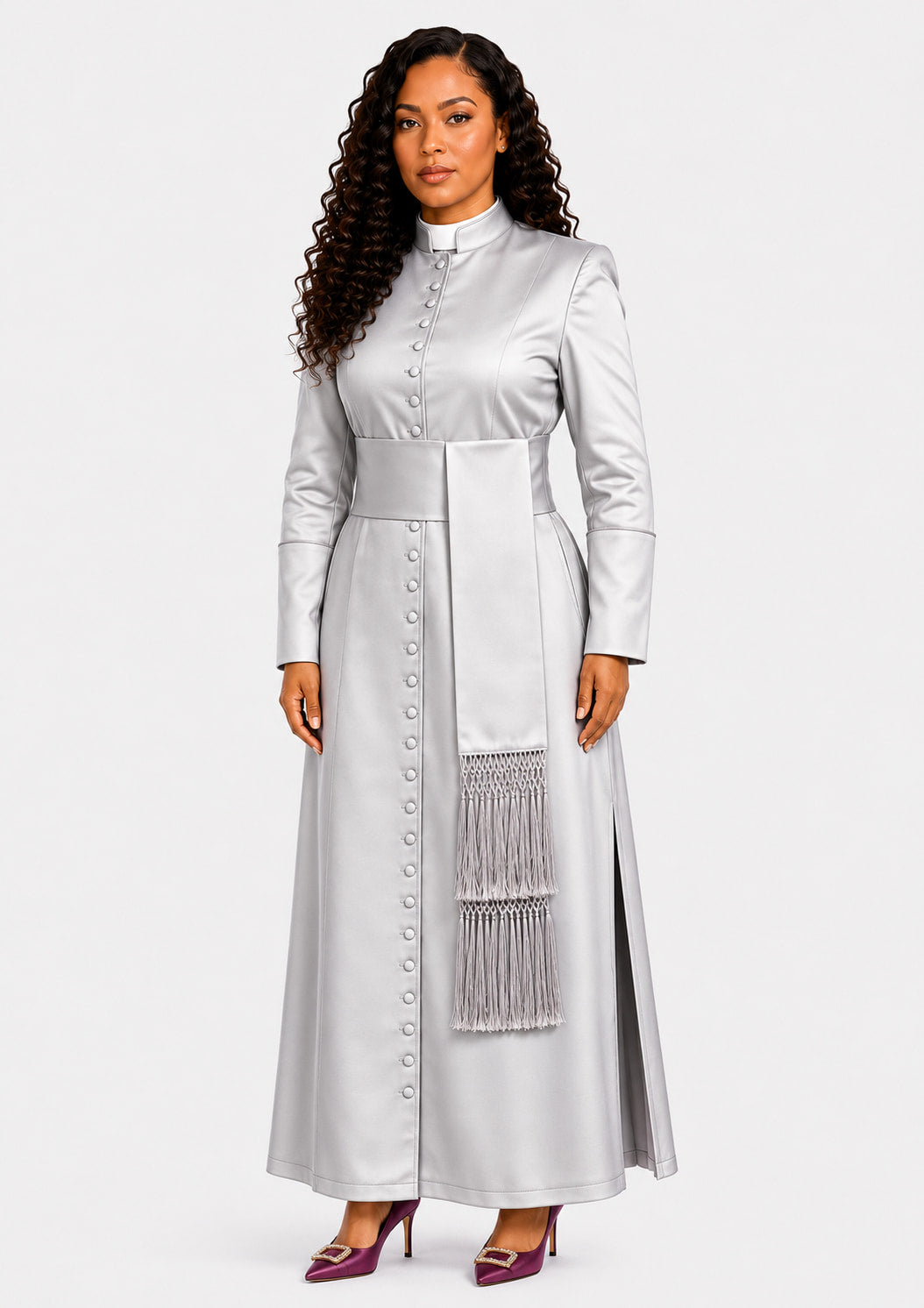Woman wearing a long light gray robe with a fringed detail on a white background