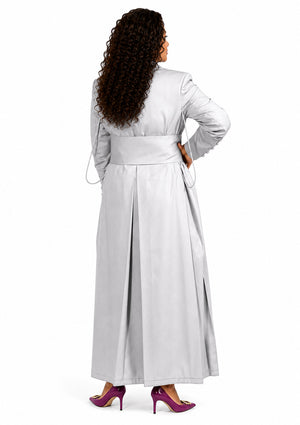 Woman wearing a long light gray robe on a white background