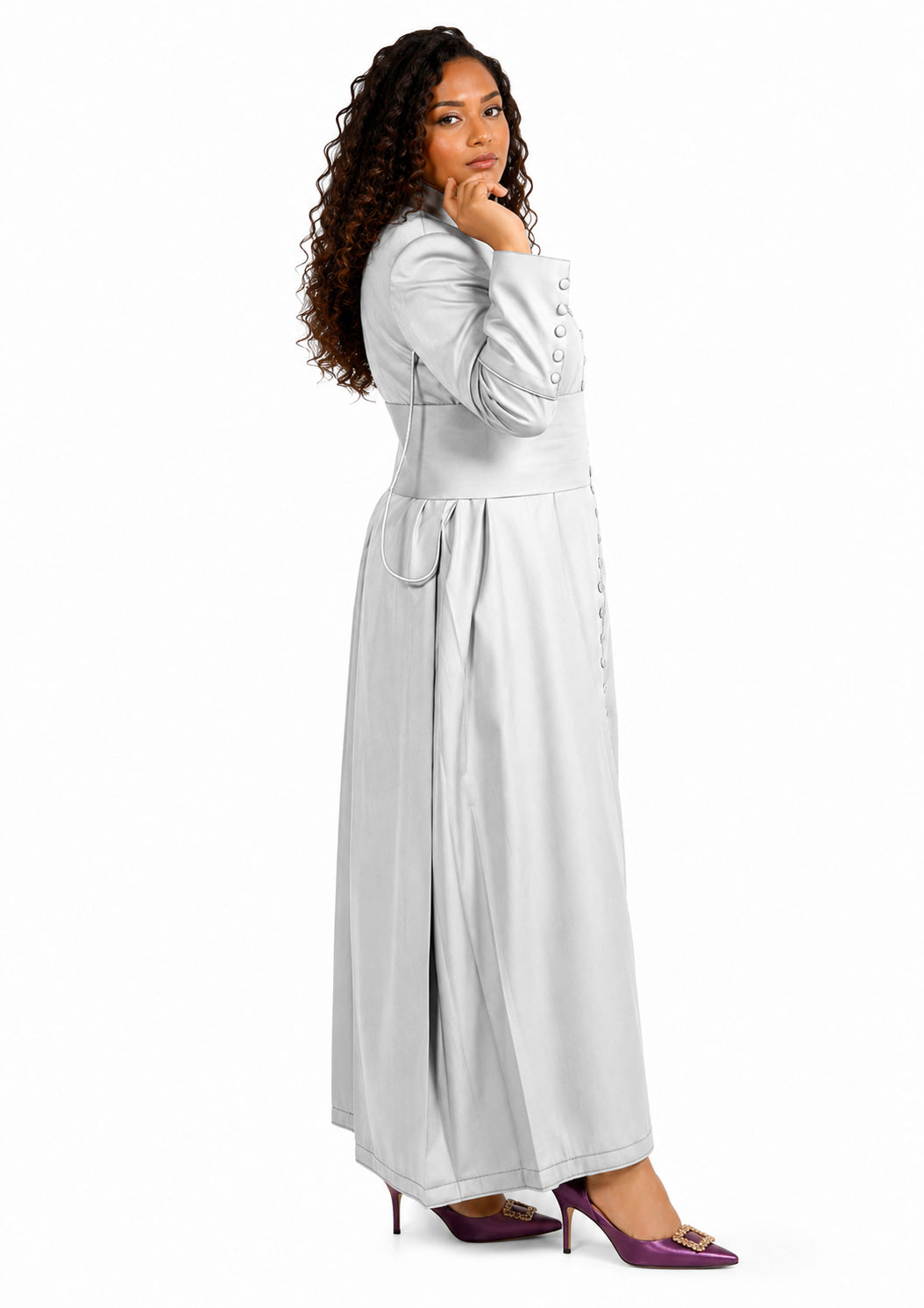 Woman wearing a long light gray robe with a belt on a white background
