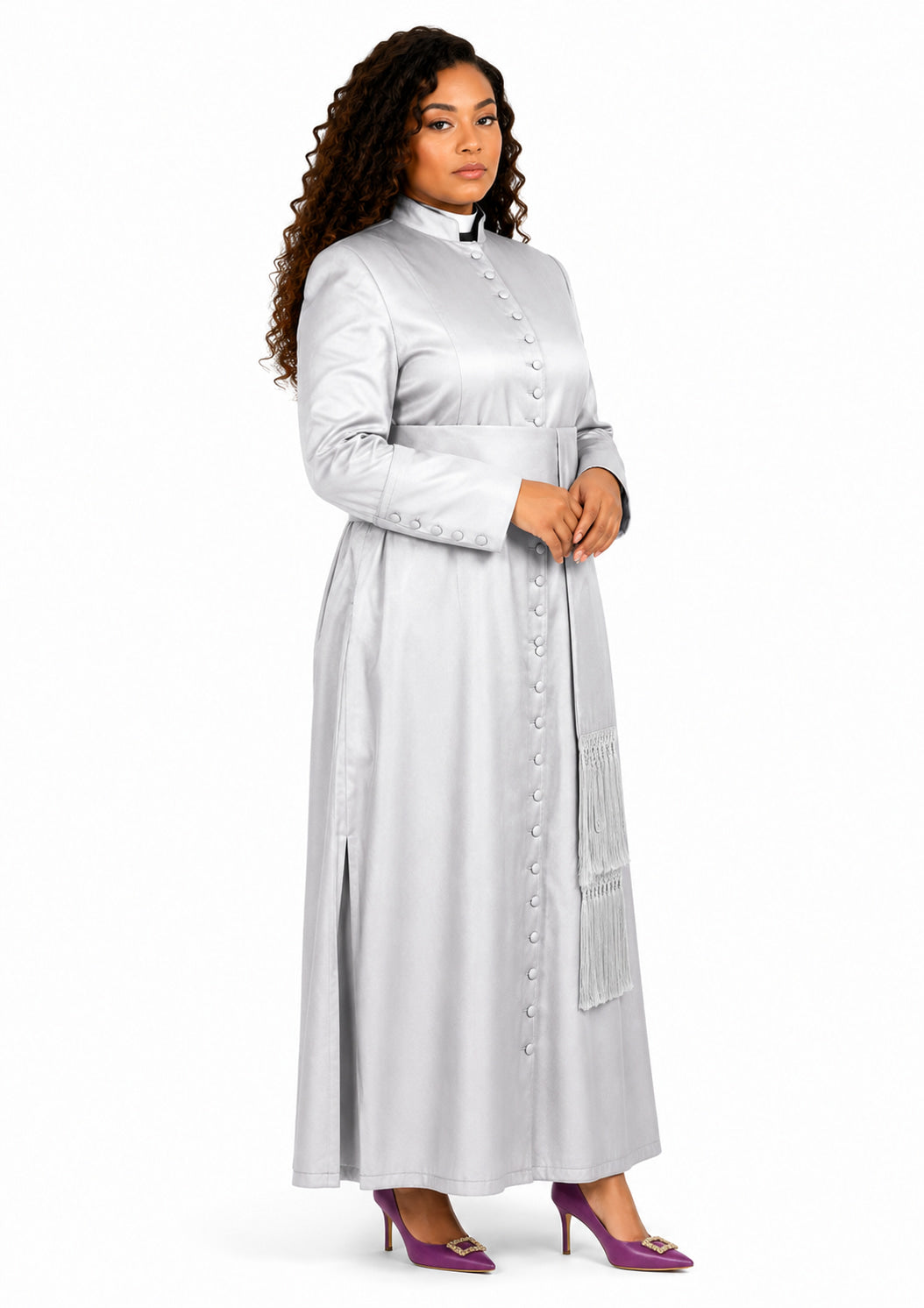 Woman wearing a long light gray robe with a white collar on a white background