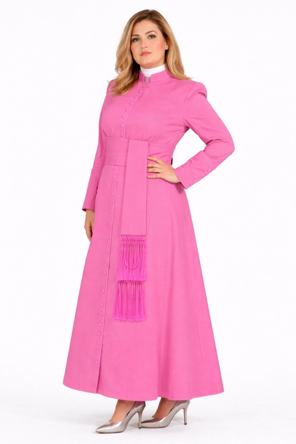 Woman wearing a pink robe with a white collar on a white background