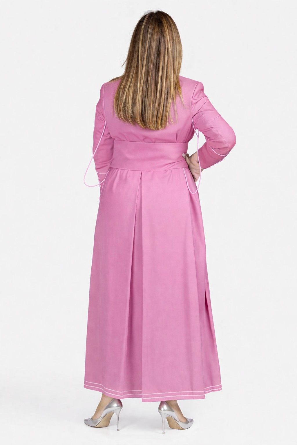Woman wearing a pink robe with a white background