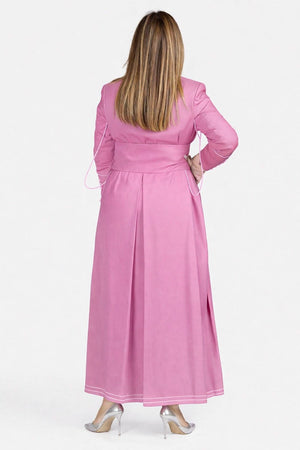 Woman wearing a pink robe with a white background