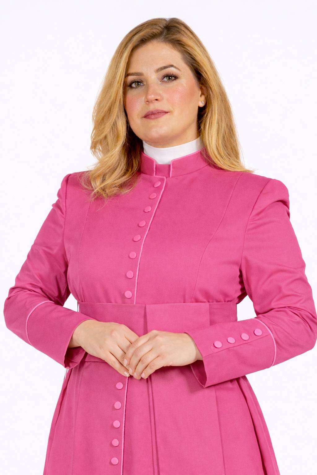 Woman wearing a pink robe with a white collar on a white background