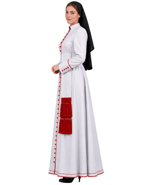 A woman modeling a Pious White Anglican Cassock With Red Trim with red trim, red decorative buttons, and a red tassel detail, paired with a black veil, against a plain white background.