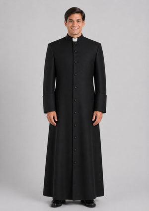 Priest wearing a black cassock on a gray background