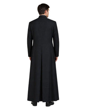 A man viewed from the back wearing a long black robe over a dark suit, standing against a plain white background.