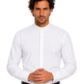 Man wearing a white clerical shirt and black pants on a white background