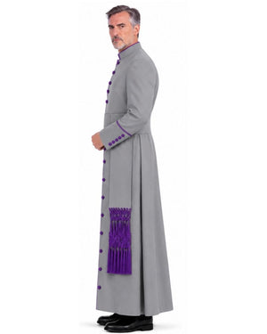 A man wearing a Purple Abdiel Clergy Cassock, purple trim, and a purple sash detail, shown in profile against a white background.