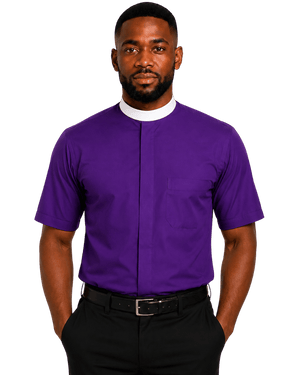 A man wearing a purple short-sleeve clerical shirt with a white collar, paired with black trousers and a black belt, standing against a solid white background.