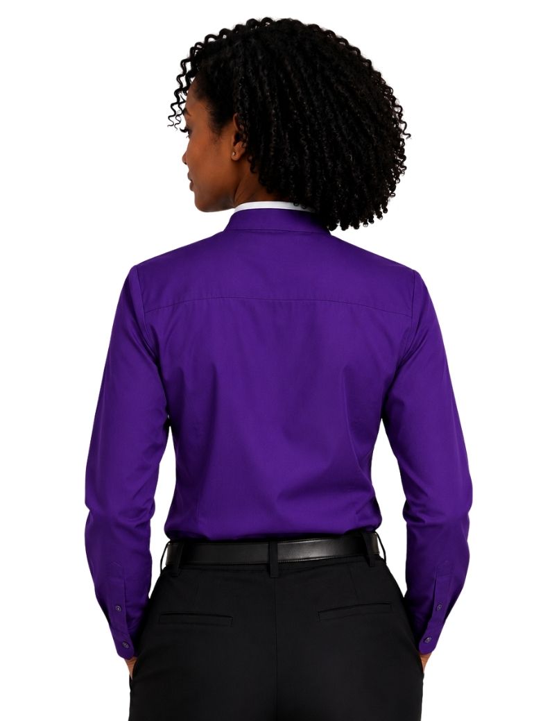 A woman shown from the back wearing a vibrant purple long-sleeve clerical shirt tucked into black trousers, against a plain white background.