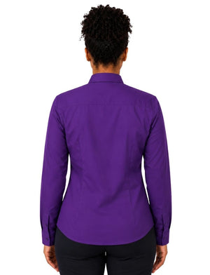 A woman viewed from the back wearing a solid purple long-sleeve clerical shirt and black pants, set against a plain white background.