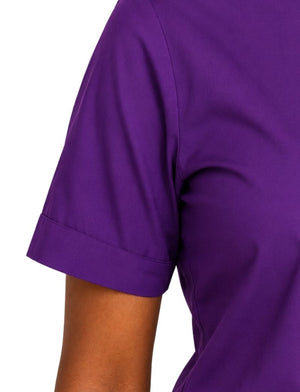 Close-up of a woman wearing a solid purple short-sleeve top, showing the sleeve cuff and part of the arm against a plain white background.
