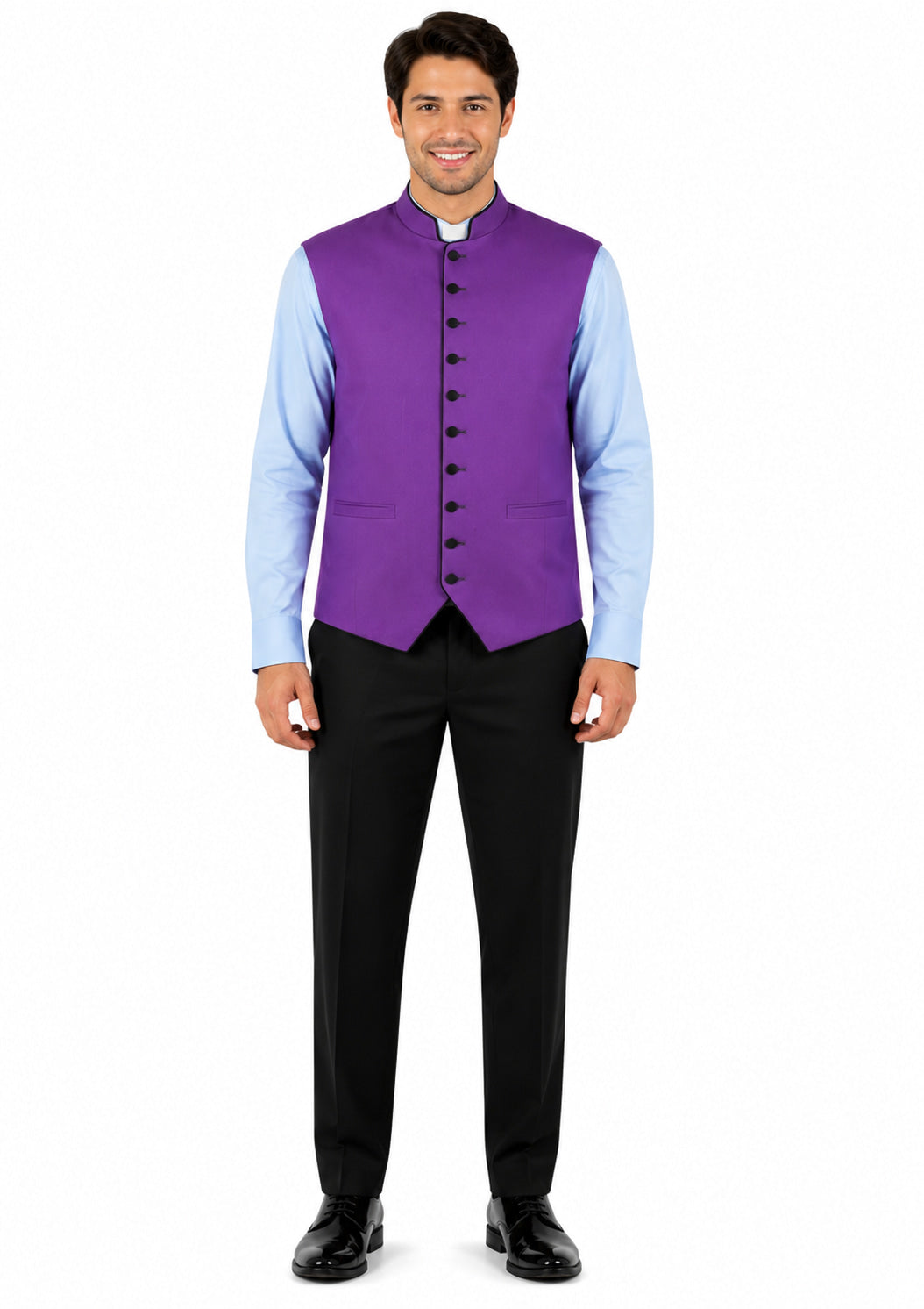 Man wearing a purple vest over a light blue shirt with black pants on a white background