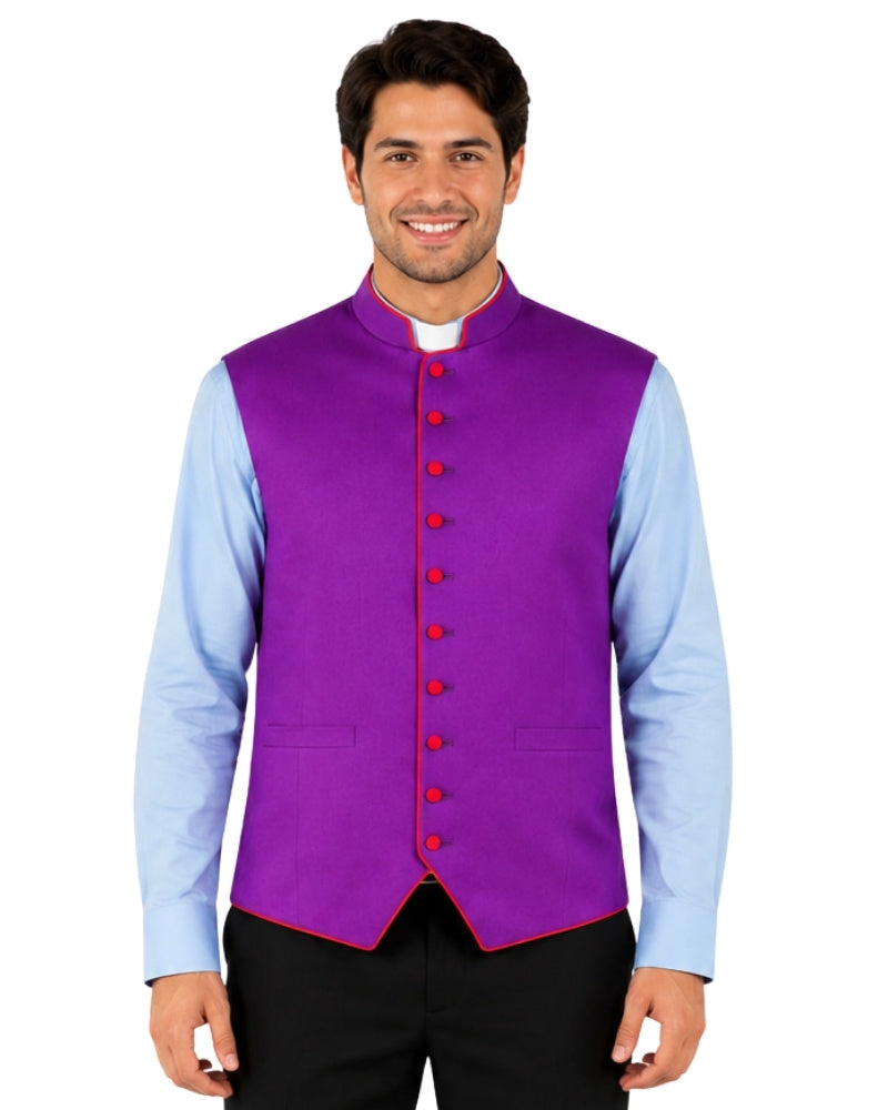 Man wearing a purple vest over a light blue shirt with black pants on a white background.