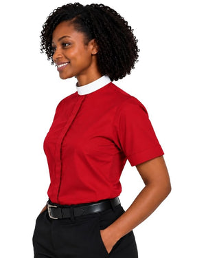 A woman wearing a short-sleeve red clerical shirt with a contrasting white collar, paired with black trousers and a black belt, shown in a side-profile view against a plain white background.
